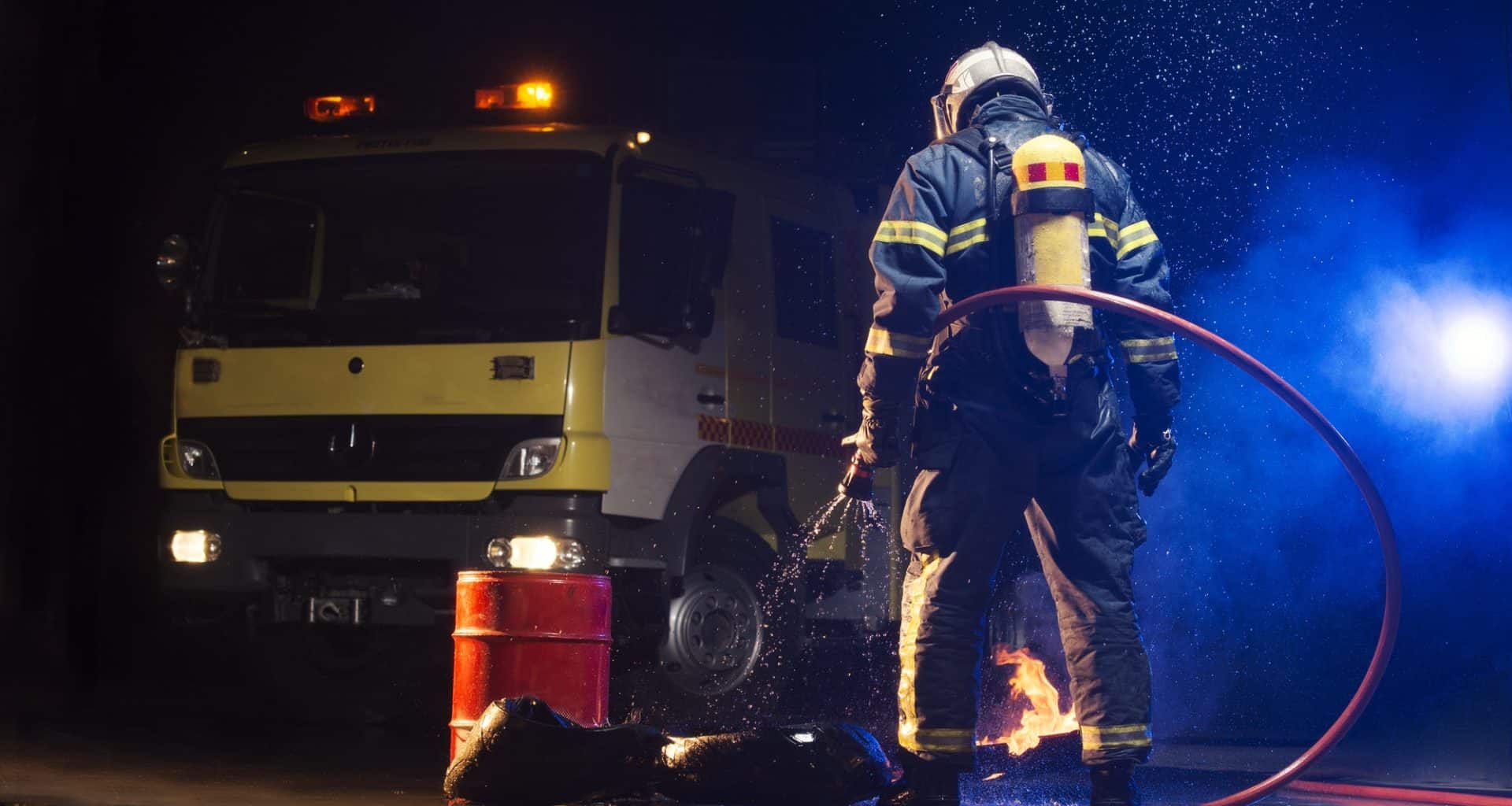 Muscular firefighter on mission